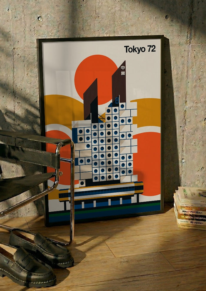 Tokyo 72 by Bo Lundberg in a black frame leaning against a concrete wall by a steel chair