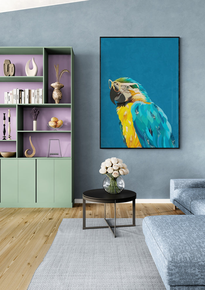 Art print of a colorful macaw wearing glasses by Sarah Manovski, displayed in a modern living room.