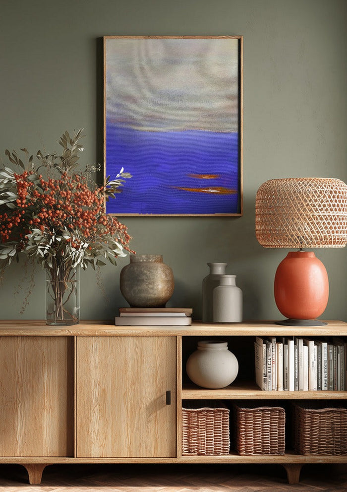 Violet Sea by Marina Agre above a wooden sideboard on a sage green wall