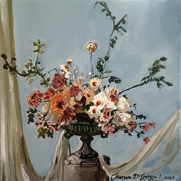 Wedding Arrangement by Mariam De Giorgio - cream roses and coral dahlias in a cast-iron urn on pale blue