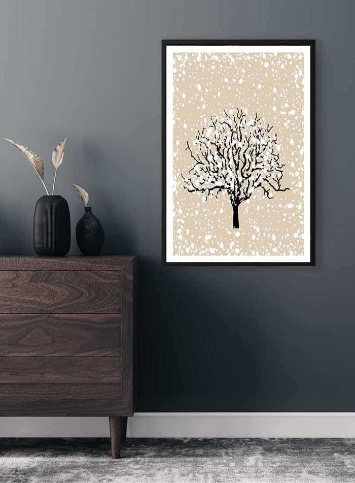 Framed Winter Tree Plakat featuring a bare tree with snow, displayed on a dark wall above a wooden dresser.