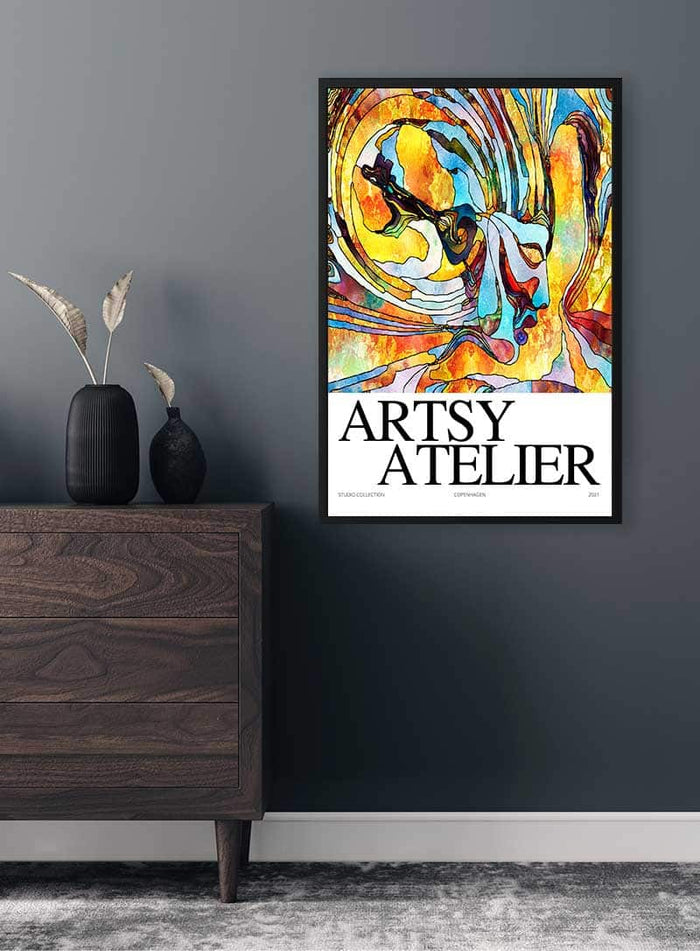 Yellow Collage Artsy Plakat with abstract swirls in yellow, orange, and blue, framed on a dark wall.