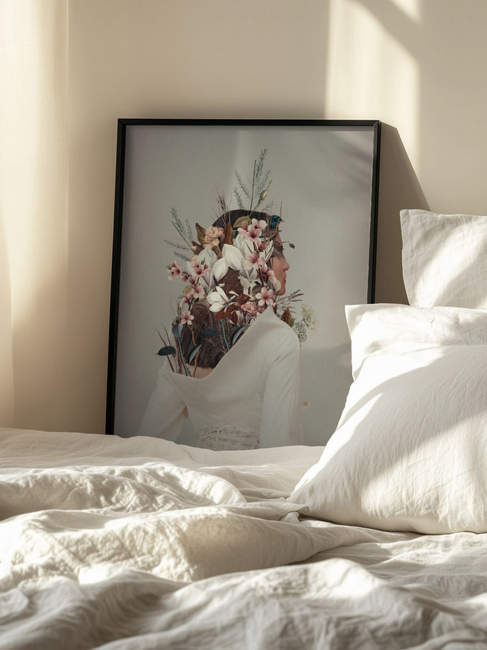 Framed "You Gifted Me an Autumn" artwork by Frank Moth resting against a wall beside a sunlit bed.